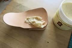 Thumbnail for leather conditioner being rubbed into a leather purse