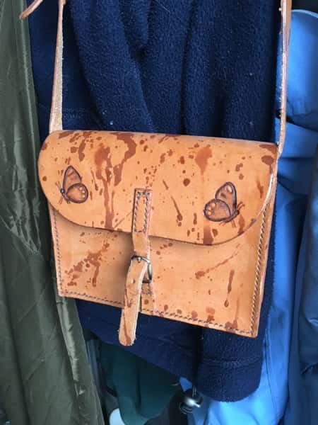 Leather bag with fresh water marks before treatment