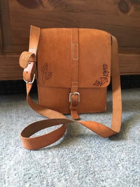 Natural leather bag after 5 years daily use showing age patina