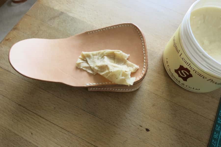 Conditioning a leather pouch