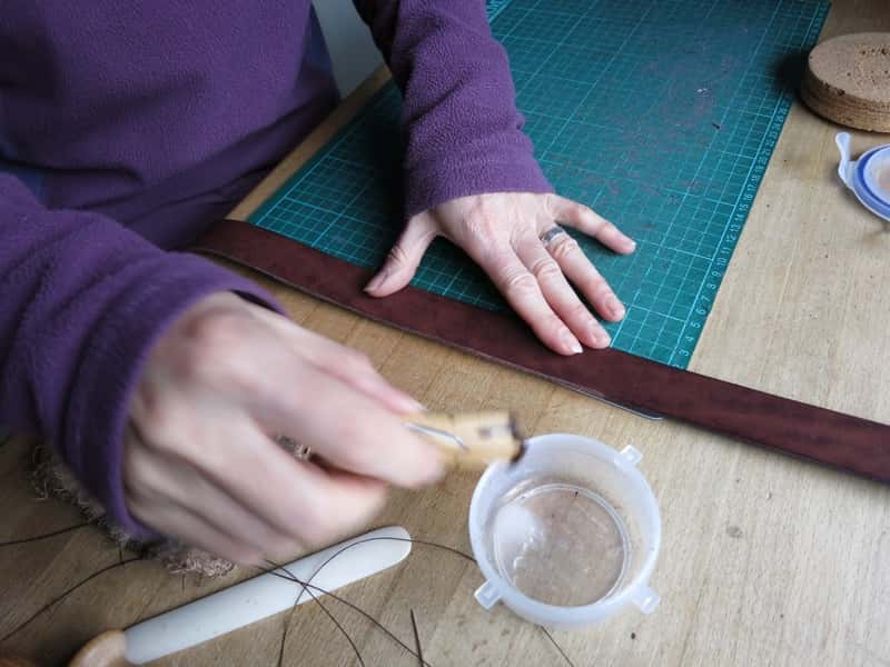 Preparing to burnish a leather belt