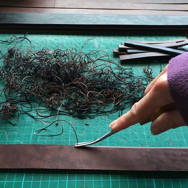 Beveling a leather belt