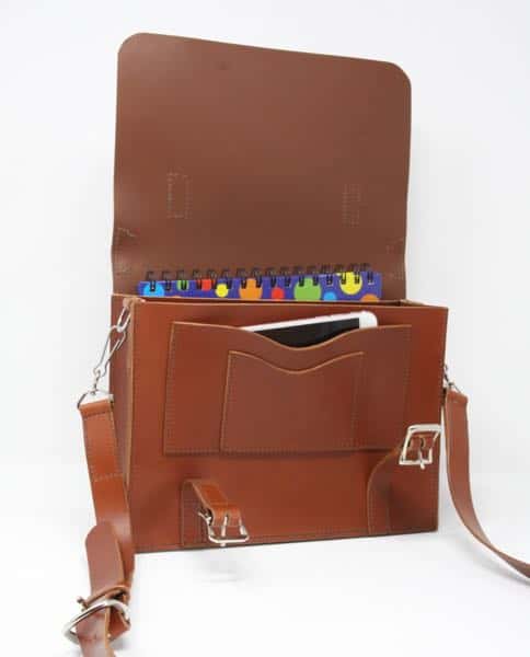 Leather A5 satchel shoulder bag open showing an iPhone and note pad