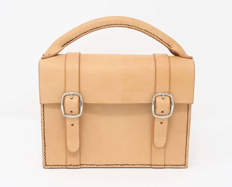 Mini satchel leather handbag on white background