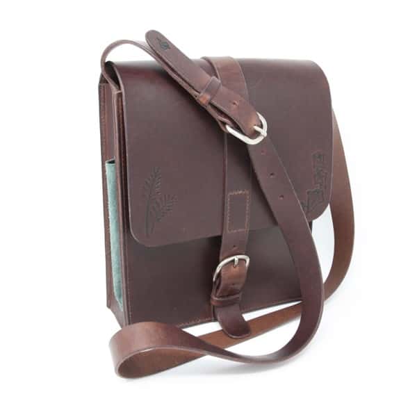 Chocolate coloured artist's sketch bag against a white background
