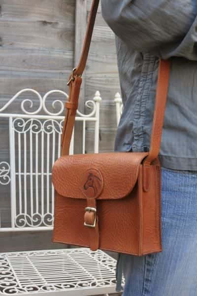 Medium leather shoulder bag with horse head motif
