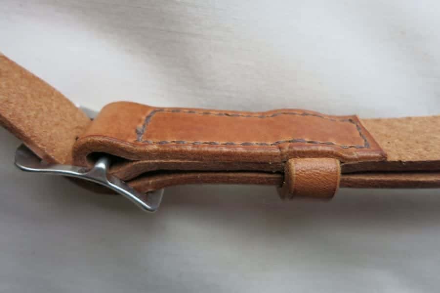 Buckle detail of medium leather shoulder bag