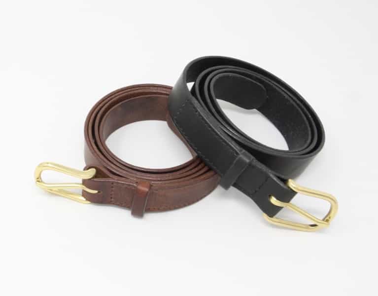 1" Italian tan leather belts. One black and silver, the other brown and brass.
