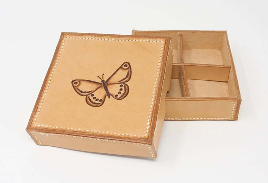 Shallow square leather box with butterfly motif