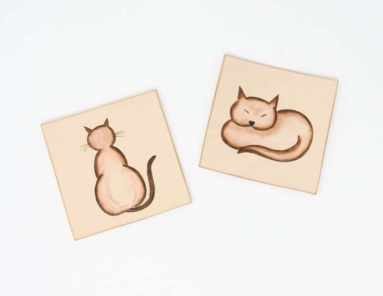Pair of cat motif square leather drinks coasters