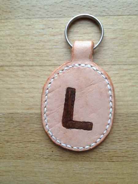 Oval leather key fob / key ring with hand-painted initial L.