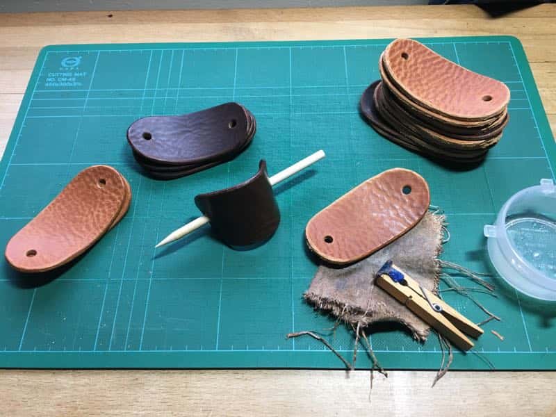 Leather hair barrettes being made