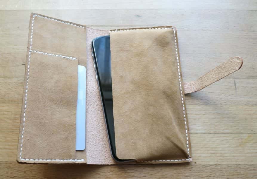 open leather phone case showing phone and credit card pouch