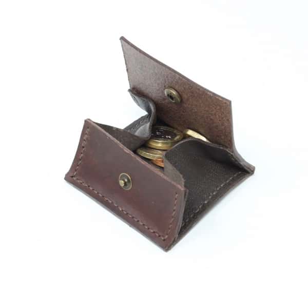 Square brown leather coin purse open showing coins