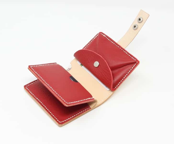 Natural leather jumbo wallet with red leather lining. Shown open.