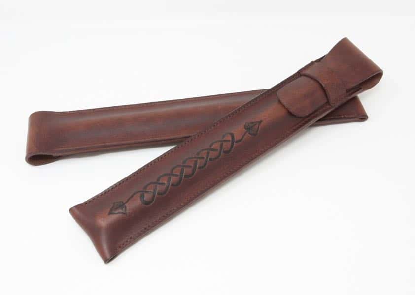 Front and back of brown leather penny whistle case