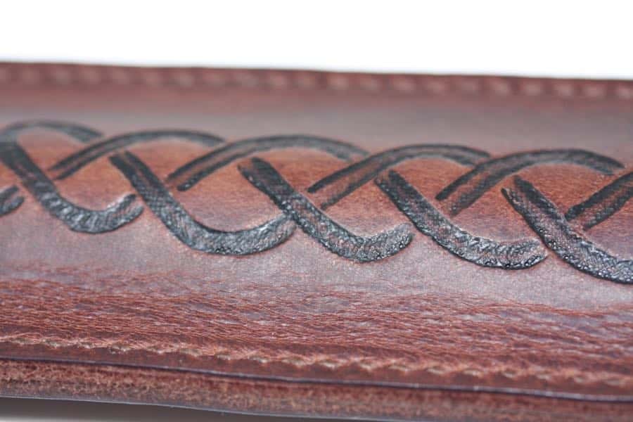 Detail of brown leather penny whistle case
