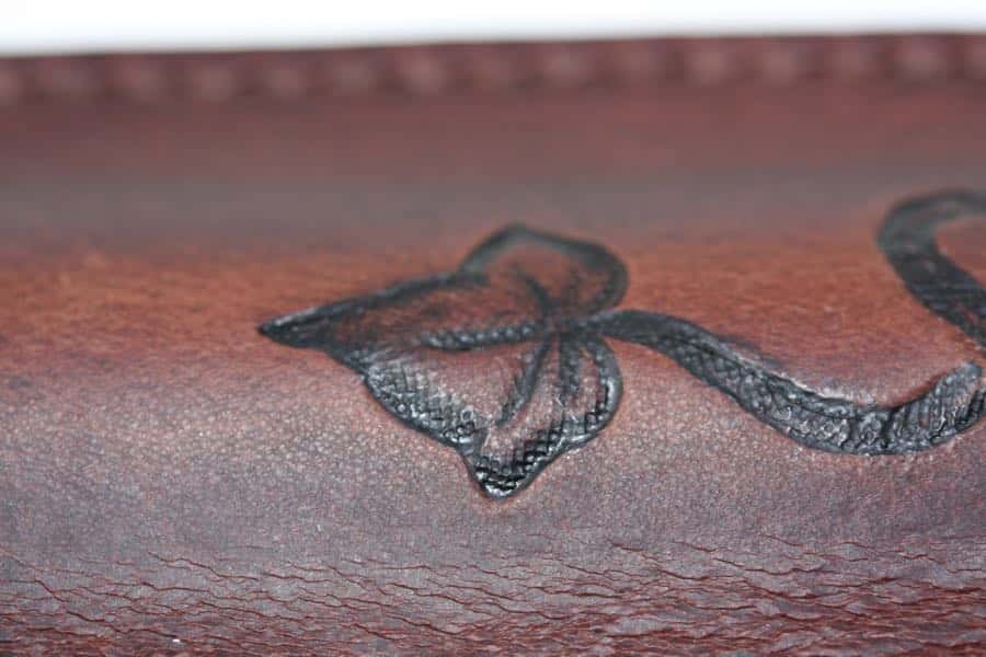 Detail of brown leather Penny whistle case