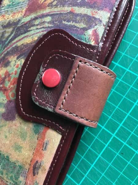 Repair to a leather organiser fastener
